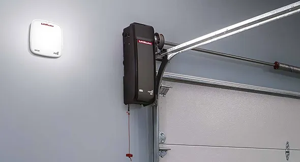 A wireless garage door opener installed on a garage ceiling, showcasing modern technology.