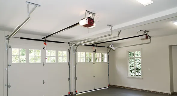 Image of a garage with an installed automatic garage door motor in Boerne, TX, showcasing a modern garage setup.