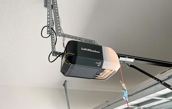 A garage door motor being repaired by a technician, with text explaining the benefits of choosing their repair services.