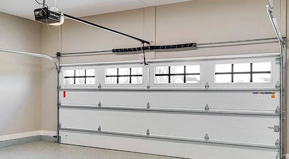 A clean and functional garage with an installed door, highlighting the end result of the service.